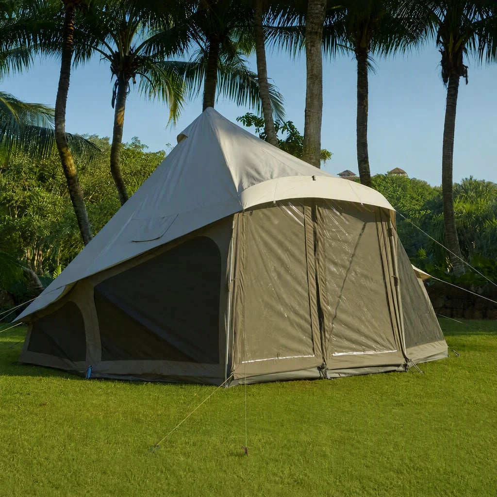 The exterior of a LIGHT bell tent at a grassy palm-tree campsite